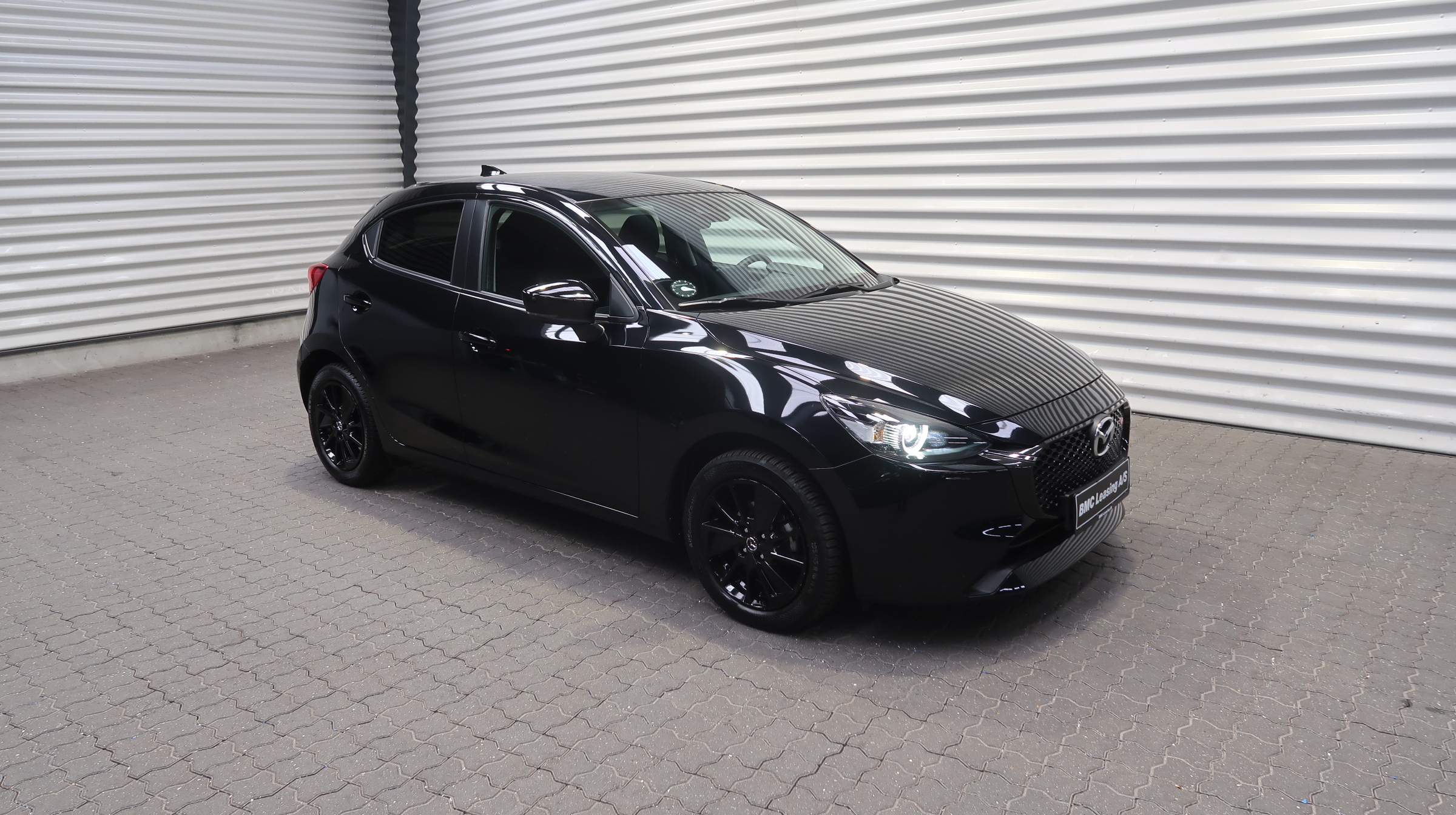 001 k25-09 908733 Mazda2 Homura SkyActiv-G aut. - Skråt forfra, højre